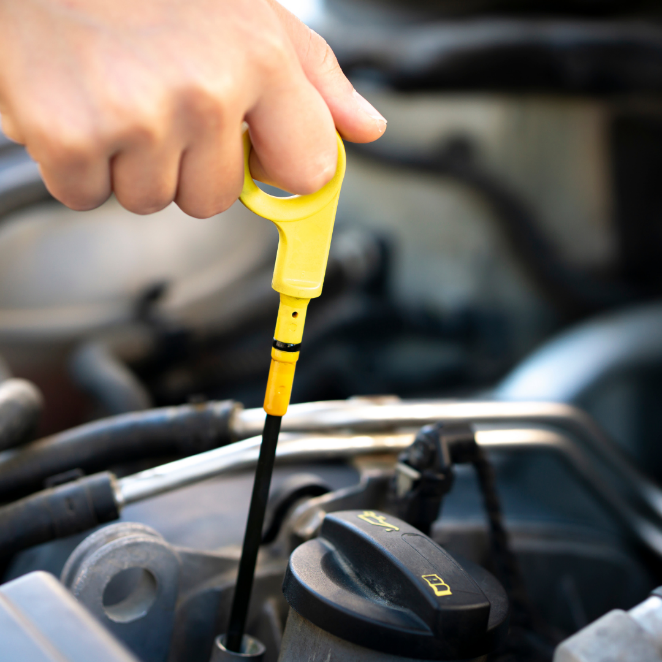 A hand holding a yellow tool

Description automatically generated