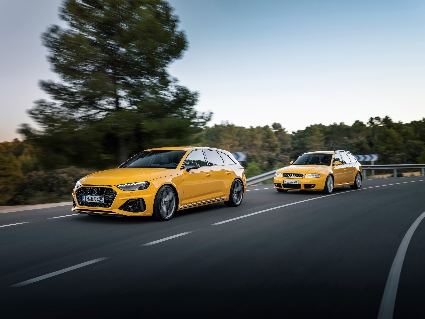 Two yellow cars on a road

Description automatically generated