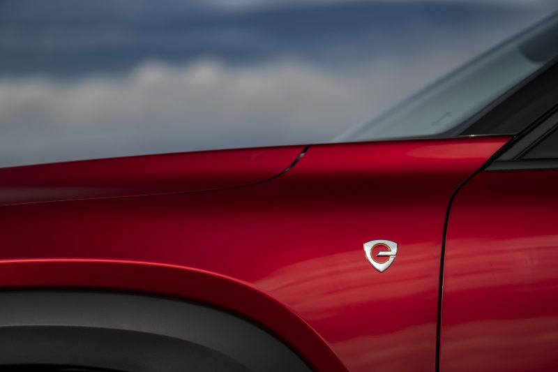 Close-up of a red car

Description automatically generated