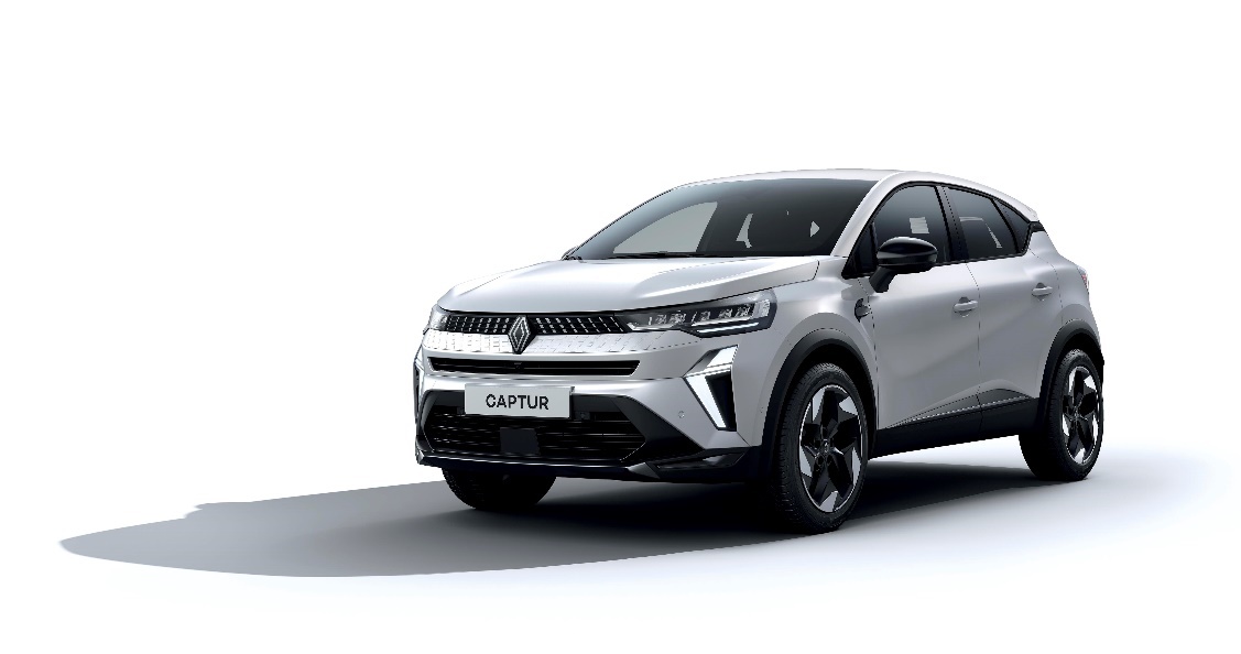 A white car with black trim

Description automatically generated