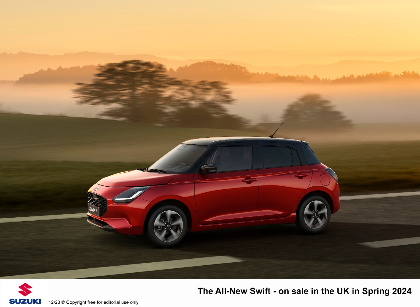 A red car on a road

Description automatically generated